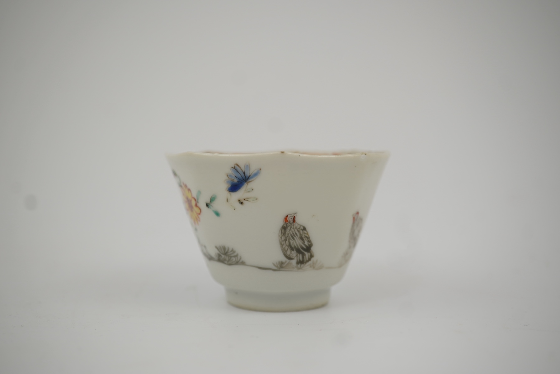 Two Chinese semi-eggshell porcelain hexagonal saucers and a similar cup, Yongzheng/Qianlong period